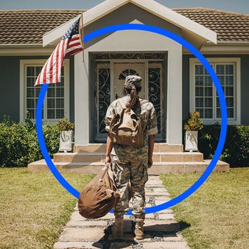 Person walking to the front door of a house