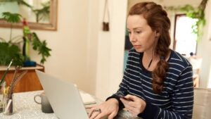 Young woman using a credit card for an online purchase