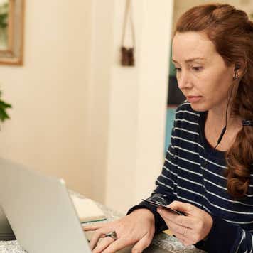 Young woman using a credit card for an online purchase