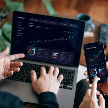 Young couple managing finance and investment online