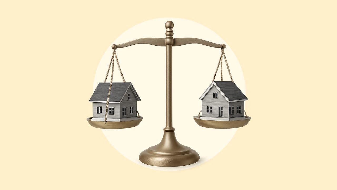 Two houses being weighed side-by-side on a balance scale over a yellow background