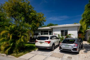 two cars in a Florida driveway