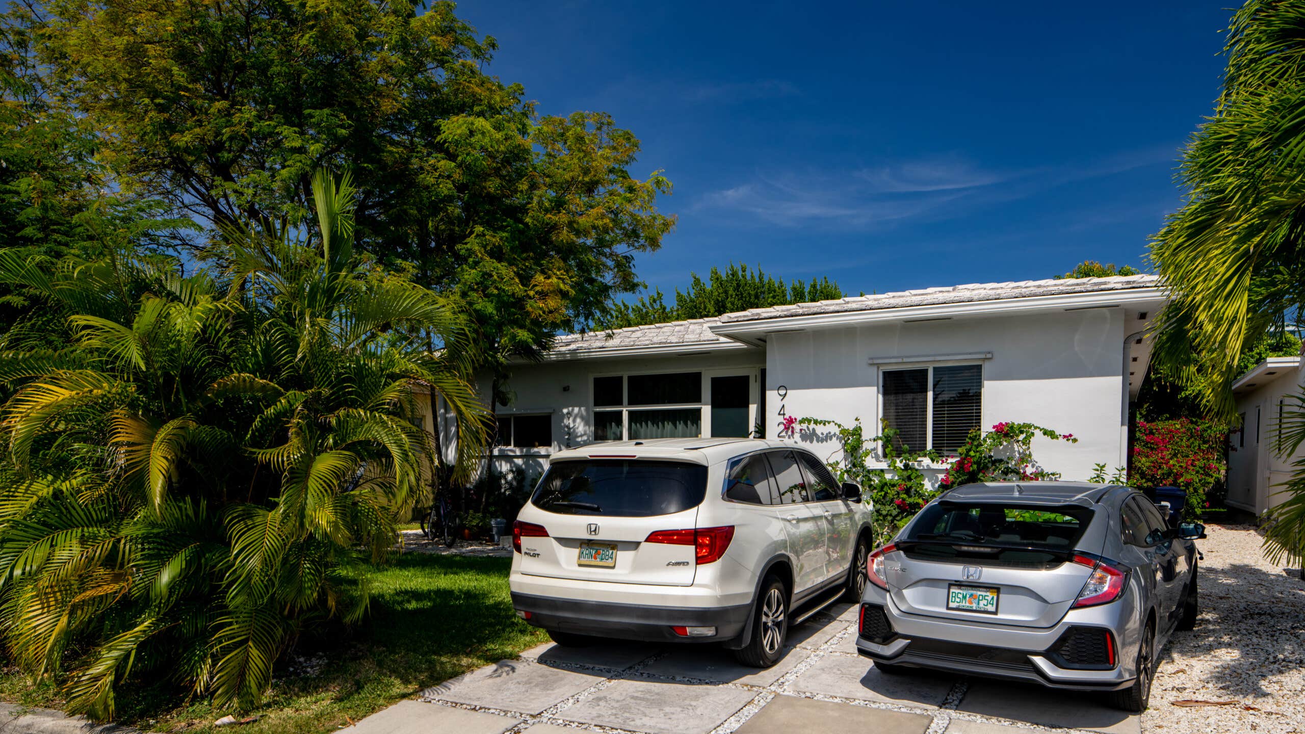 two cars in a Florida driveway