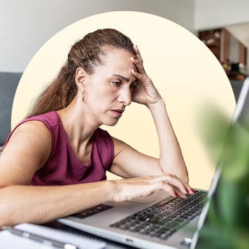 Stressed woman using a computer