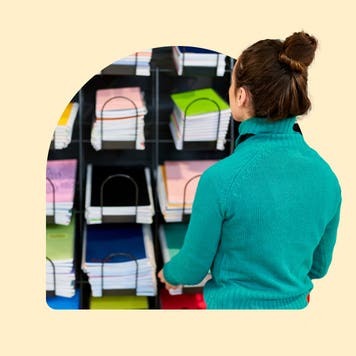 design image of a woman looking at books on a shelf