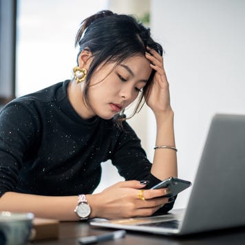 white-collar woman looks tired in the office