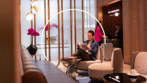 Person sitting in airport lounge reading a book