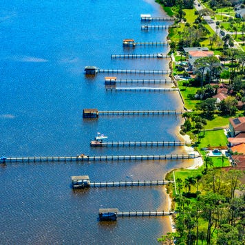 Aerial view of a group of residential boat docks from homes along the Halifax River in Ormond Beach, Florida near Daytona