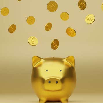 Golden piggy bank and golden coins