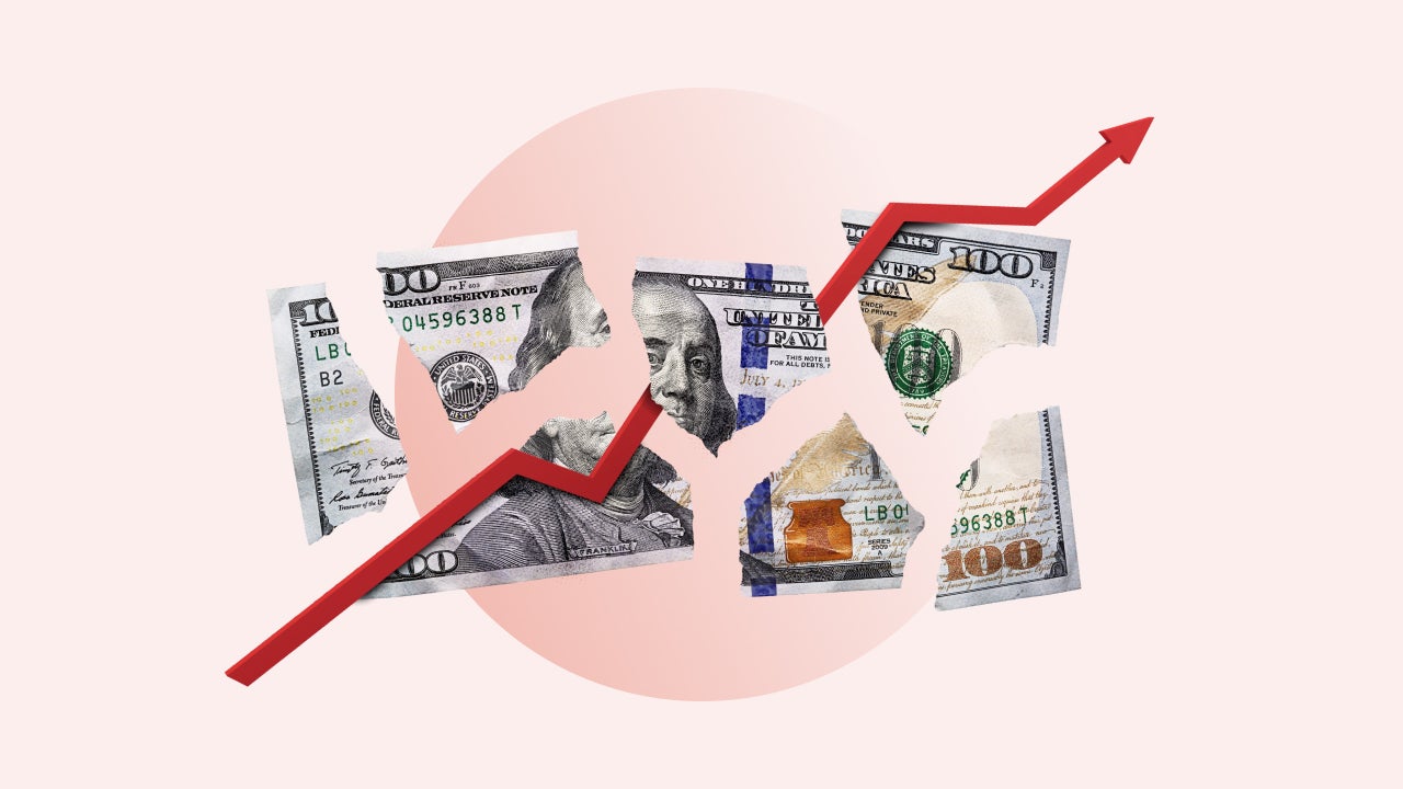 Image of a torn apart one hundred U.S. dollar bill with a red jagged graph line running through the the torn pieces.