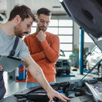People looking at car