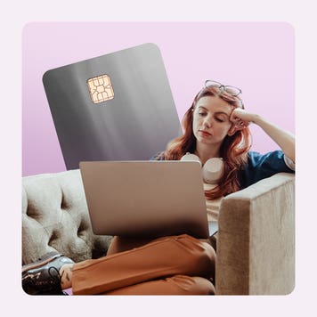 Credit card writer, Ana Staples, with a laptop and in a chair.