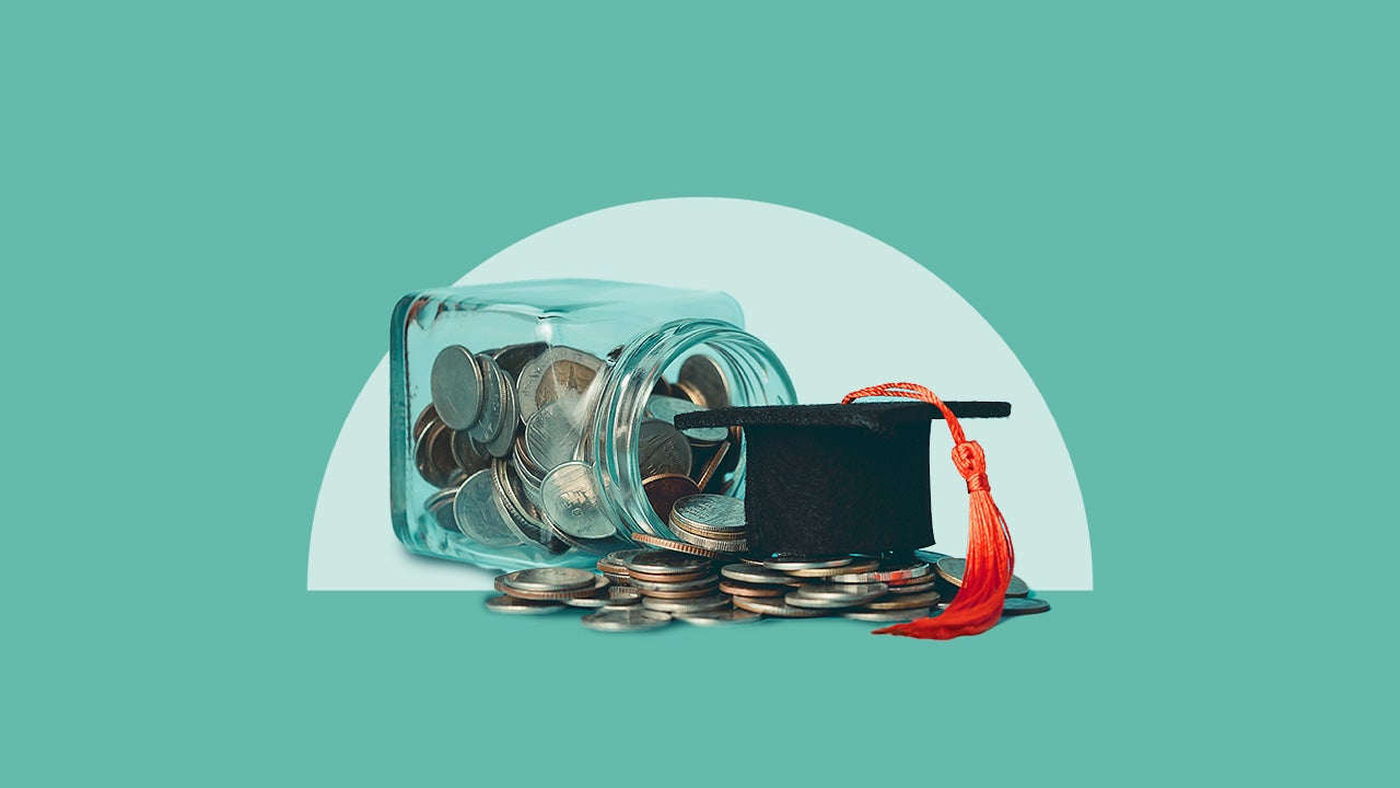 A jar of coins on its side spilled over with a graduation cap perched on top of the coins