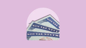 Three Social Security cards fanned out.