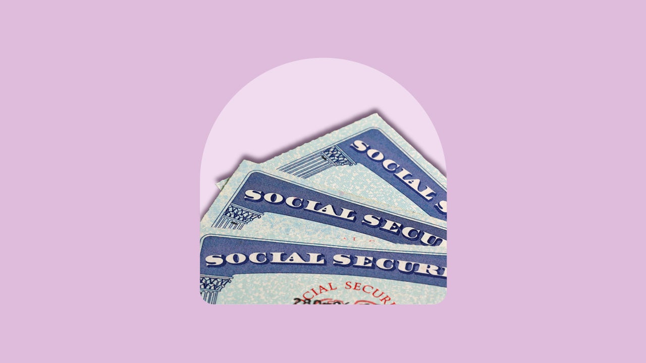Three Social Security cards fanned out.