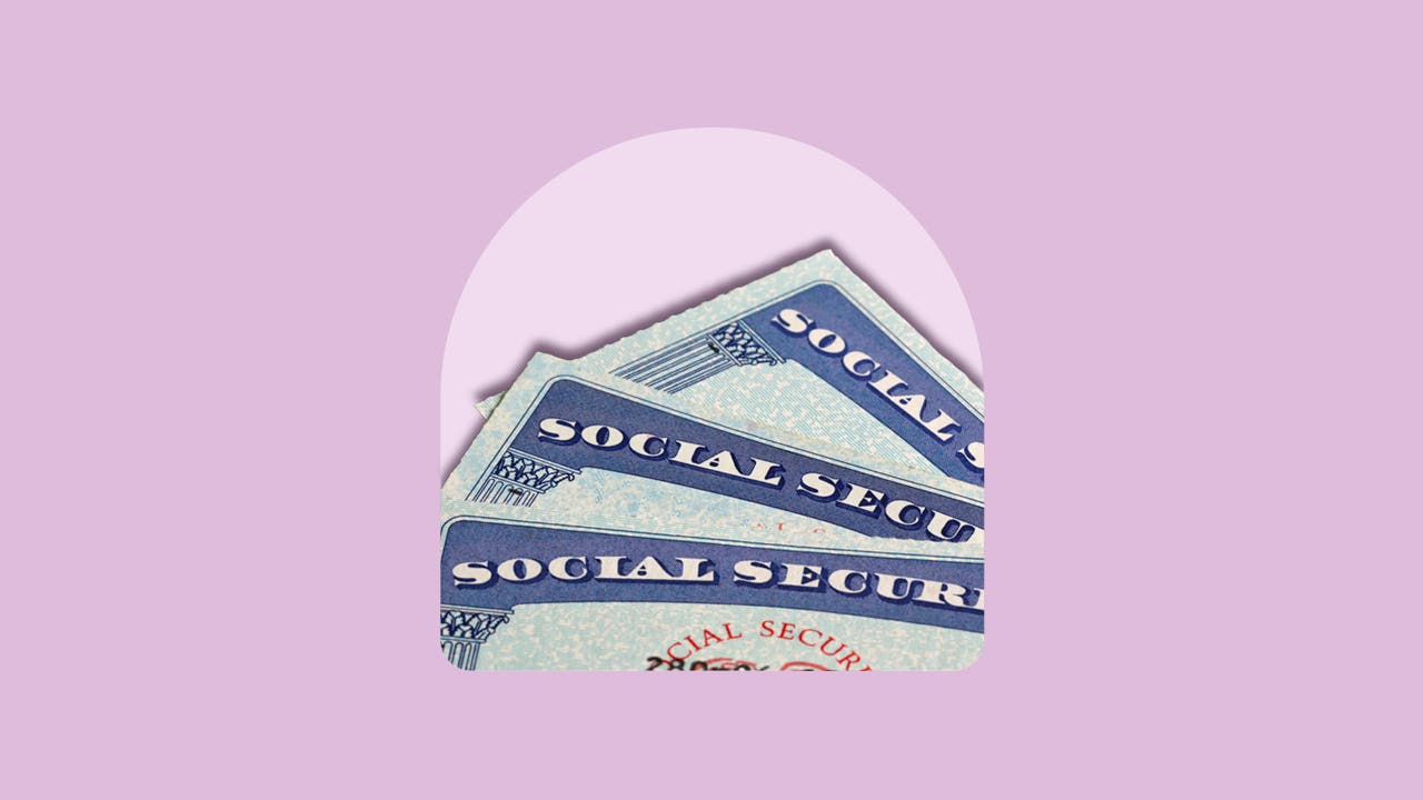 Three Social Security cards fanned out.