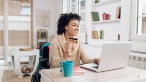 African-American woman in a wheelchair enjoying shopping online