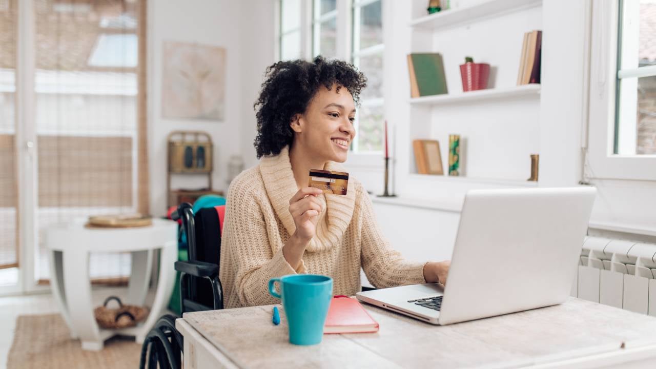 African-American woman in a wheelchair enjoying shopping online