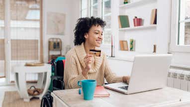 African-American woman in a wheelchair enjoying shopping online