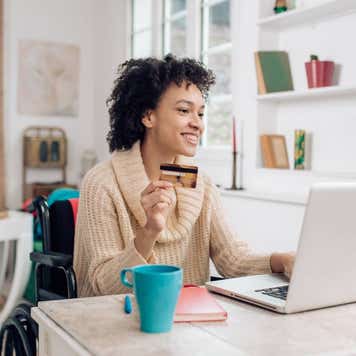 African-American woman in a wheelchair enjoying shopping online