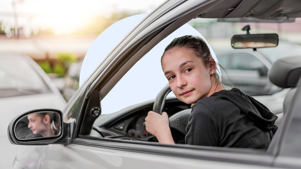 Person driving a car and looking back as they back up