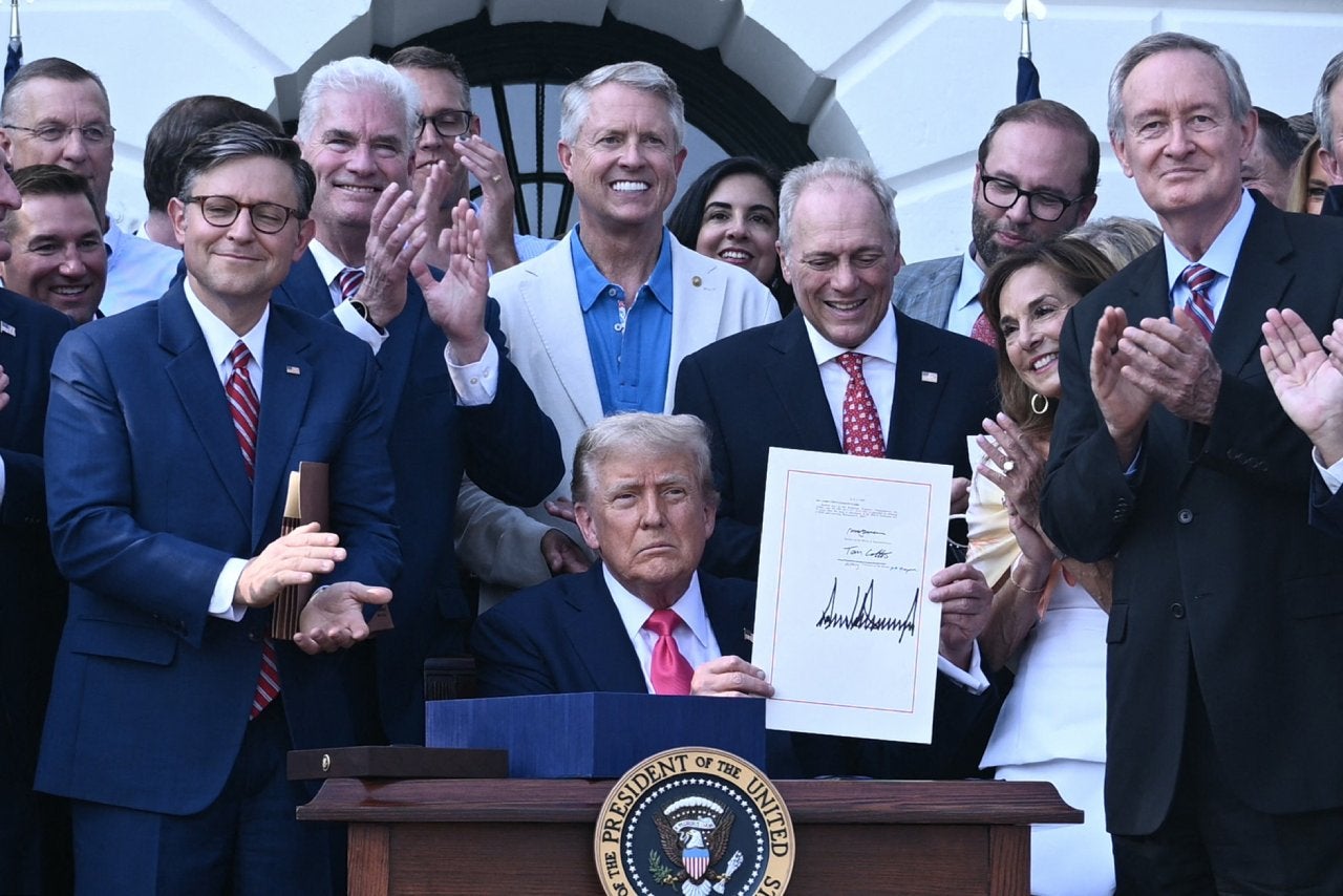 US President Donald Trump shows his signature on the "Big Beautiful Bill Act" at the White House in Washington, DC, on July 4, 2025.
