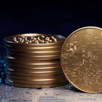 A stack of golden coins representing crypto tokens.