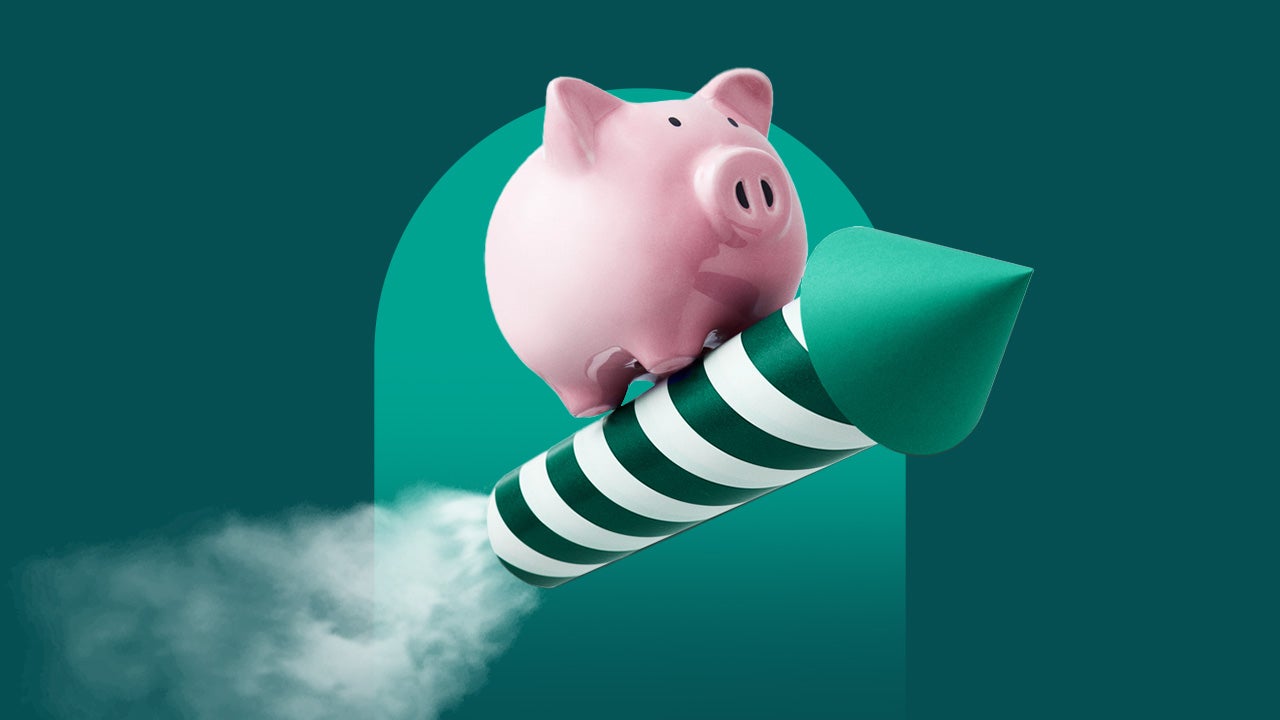 An image of a pink piggy bank standing on top of a green and white striped rocket with smoke coming out of the end of the rocket.