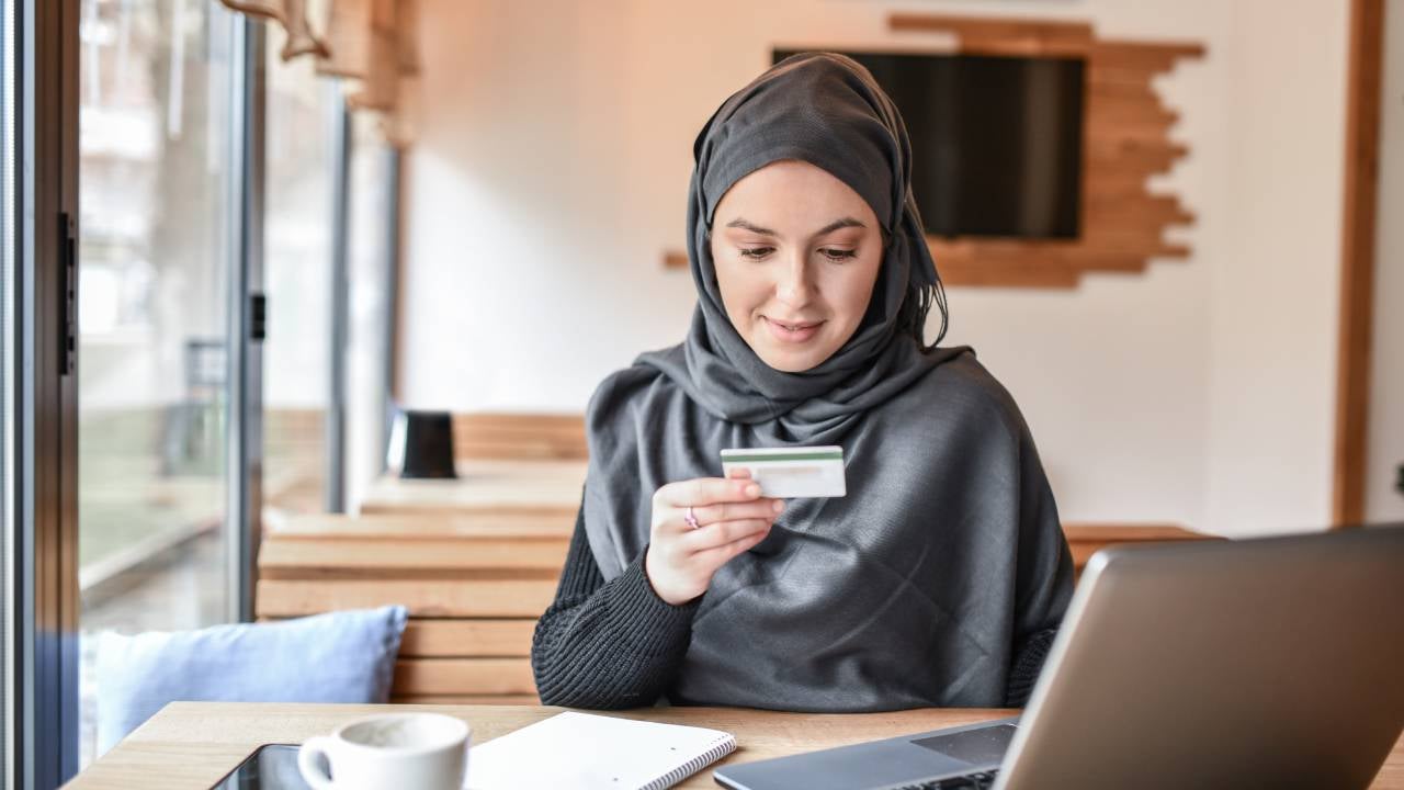 Muslim Female Smiling While Online Shopping