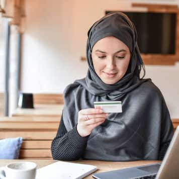 Muslim Female Smiling While Online Shopping