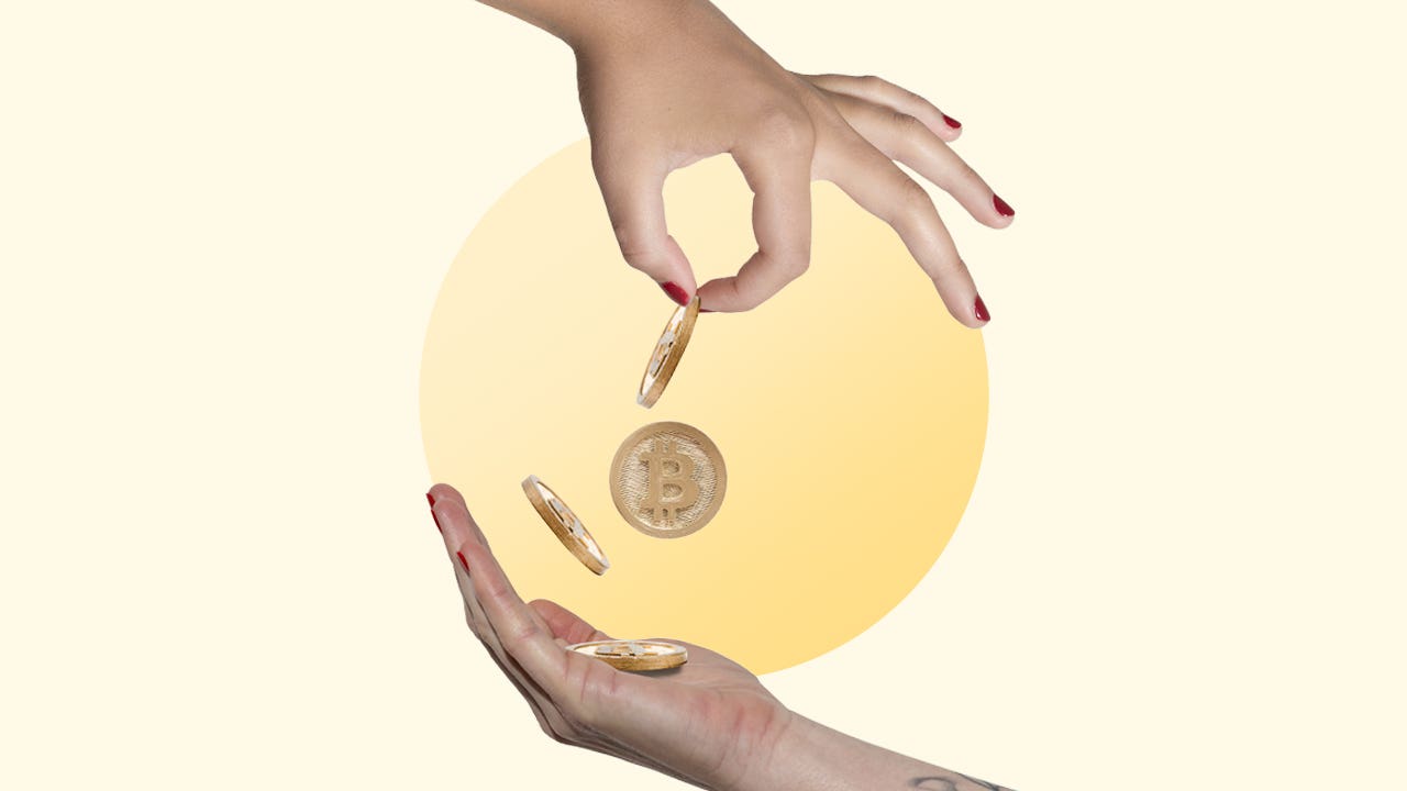Two hands exchange visual representations of bitcoins.