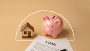 An illustration with a figure of a small house, a piggy bank and a paper with the word "LOAN" written across it.
