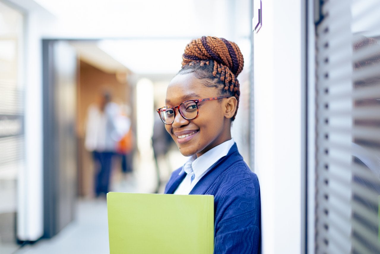 Young businesswoman happy to be back to work