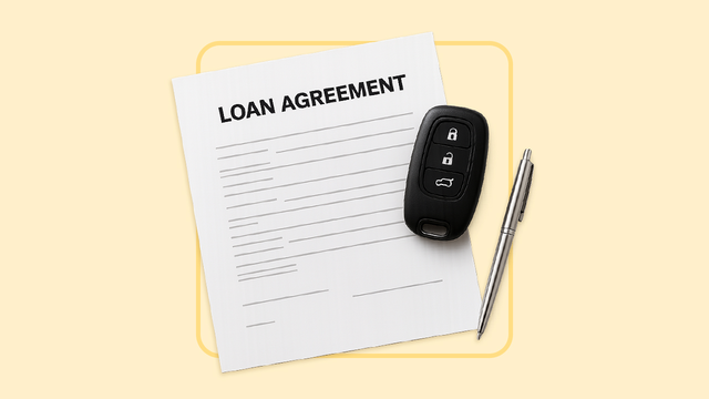 A loan contract without any text. There is a car key fob and a pen laying next to it.