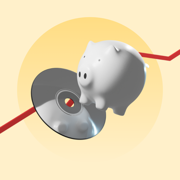 A music CD underneath a piggy bank