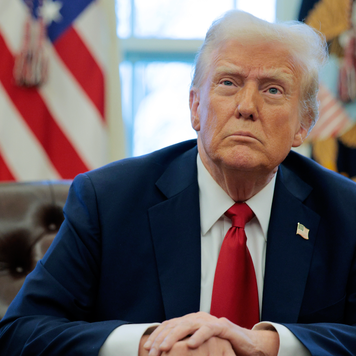 President Donald Trump sitting in the Oval Office.