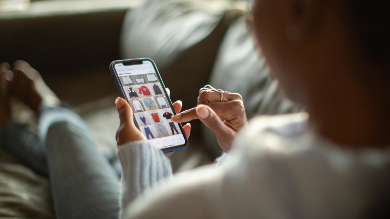 Woman purchasing clothes on a mobile app