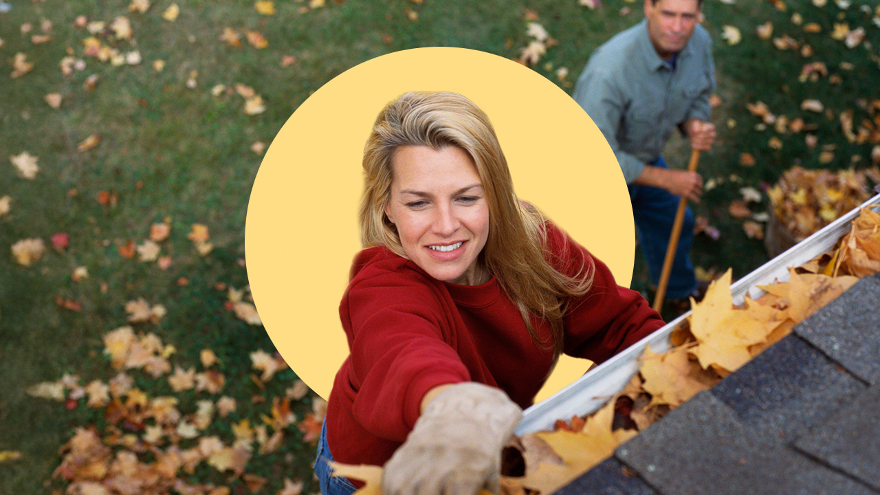 Person cleaning gutter