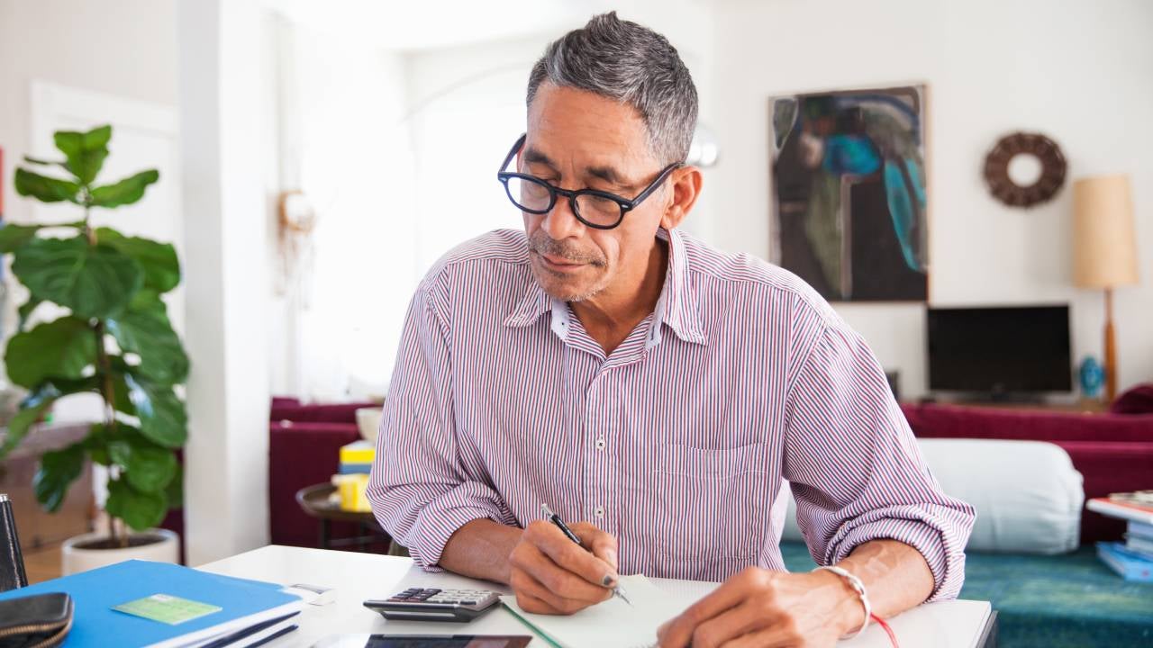 Mature man doing working at home