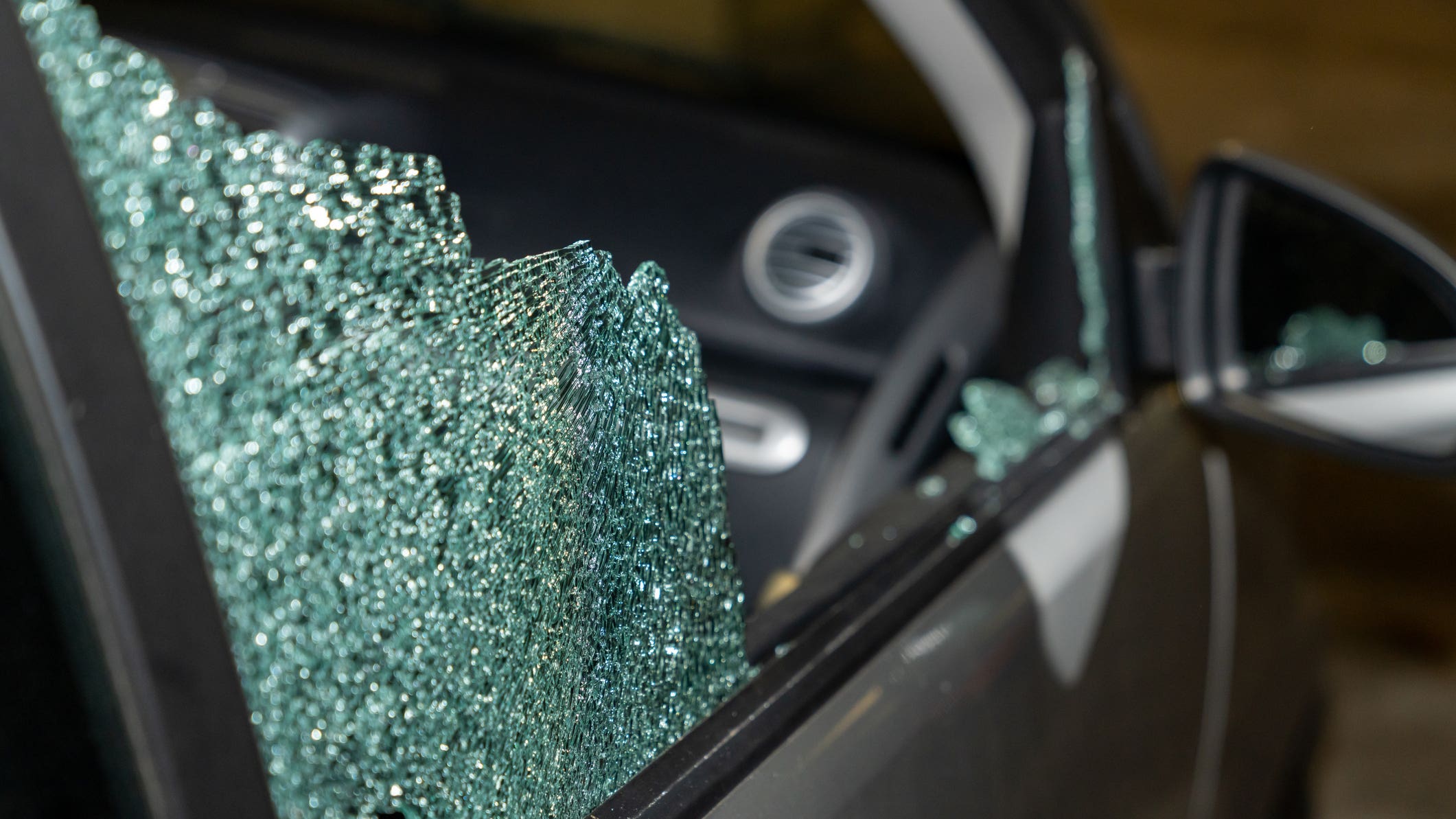 closeup of front window of vehicle shattered