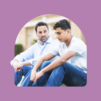 Father comforting son