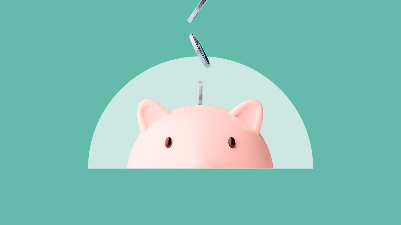 A stylized image of close up of a piggy banks upper face (eyes and ears) with coins flowing into the top of the image. The background is a greenish blue.