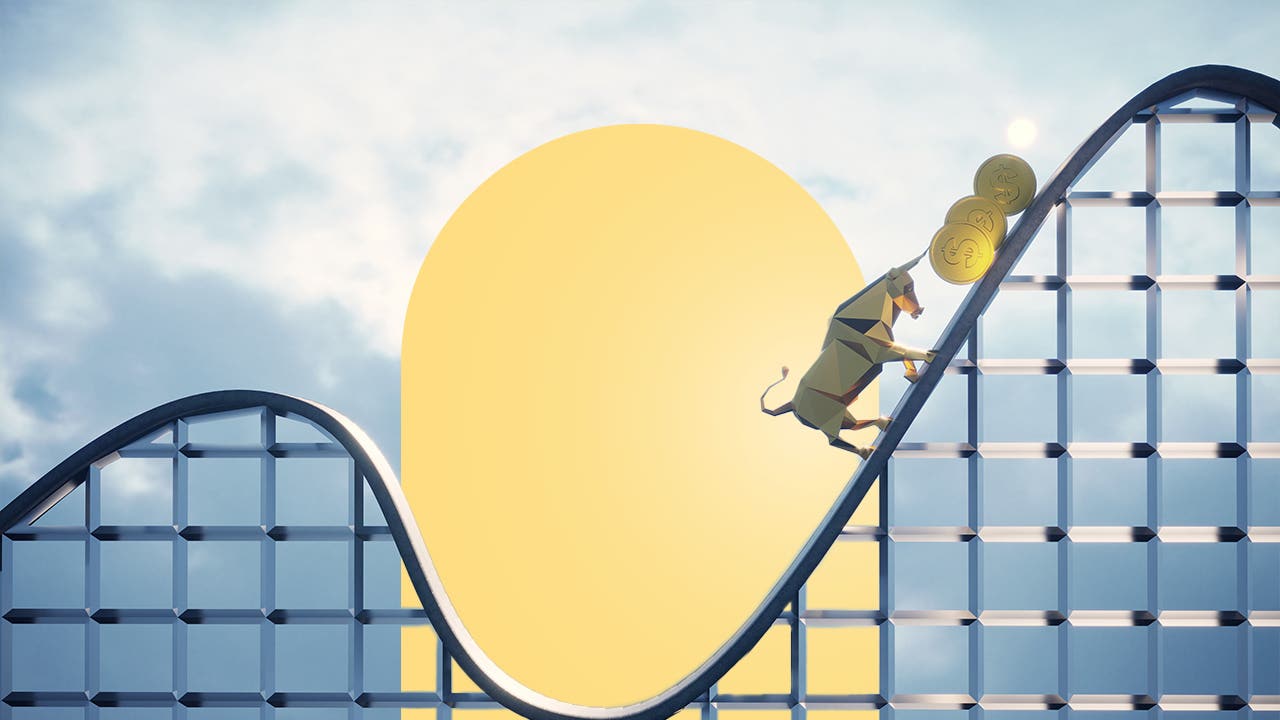 A styalized roller coaster with a bull pushing gold coins up the incline.