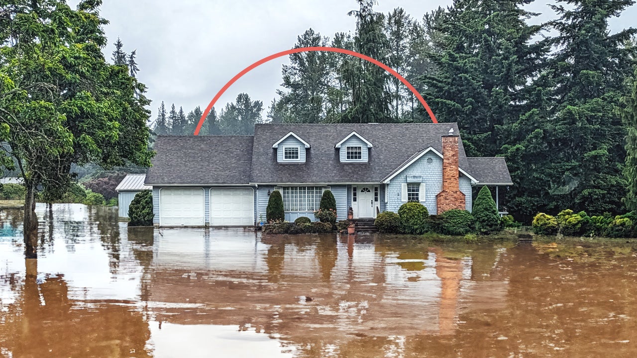 single family home submerged in floodwaters