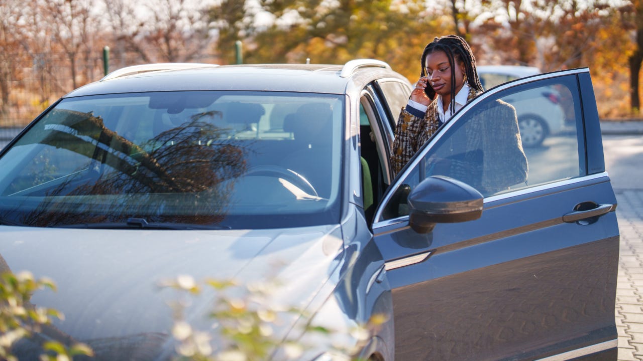 Person getting into car