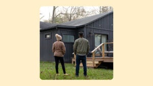 design image of a couple standing in front of their home