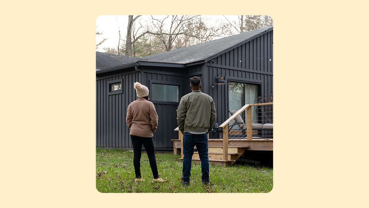 design image of a couple standing in front of their home
