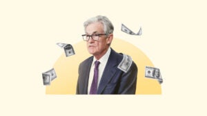 Illustration of Fed Chair Jerome Powell with money around him.