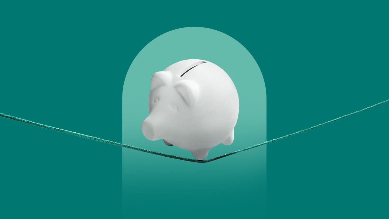 design image of a piggy bank on a tight rope