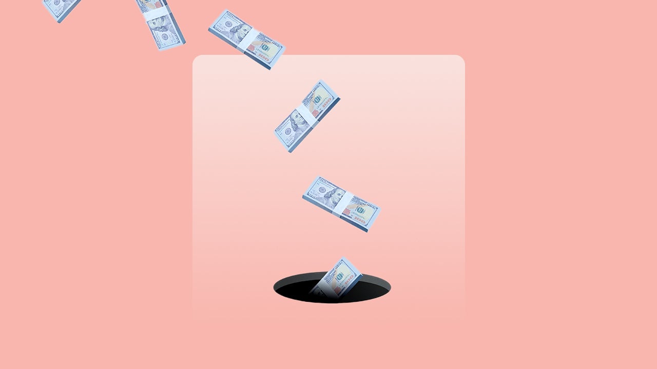 Pink background with stacks of 100 dollar bills (U.S.) falling into a hole.